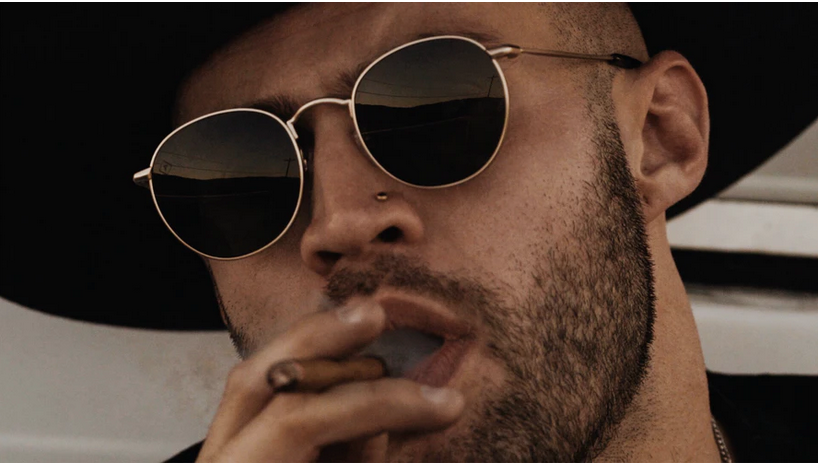 a man enjoying a ciar